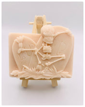 Load image into Gallery viewer, Handmade vegan soaps featuring a skeleton dancing on his RIP grave. crafted with natural French clays, activated charcoal and essential oils. a eco-friendly, zero waste gift that’s cruelty-free, skin-nourishing, and perfect for skull lovers and Halloween gifting . Small business UK