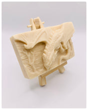 Load image into Gallery viewer, Dragon gift. Dinosaur gift. Our Flying Dragon soap features a striking dragon with its majestic wings spread wide, symbolising freedom and power. This artisan bar is vegan, cruelty-free, and designed with care for both your skin and the planet. Available in your choice of colour and essential oil. Each soap comes beautifully wrapped in eco friendly packaging. zero waste gift. kodern gift ideas. handmade home style. eco conscious home. eco friendly gifts. go green home.