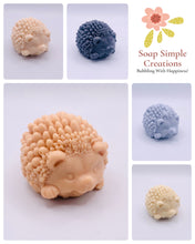 Load image into Gallery viewer, Handmade vegan soaps featuring a cute waving hedgehog, packaged in beautiful eco friendly packaging. crafted with natural French clays, activated charcoal and essential oils. a eco-friendly, zero waste gift that’s cruelty-free, skin-nourishing, the perfect gift for hedgehog lovers and animal lovers. small business UK