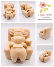 Load image into Gallery viewer, Handmade vegan cow sleeping on the sofa with book and coffee, shaped vegan soaps gift boxed. crafted with natural French clays, activated charcoal and essential oils. a eco-friendly, zero waste gift that’s cruelty-free, skin-nourishing, and perfect for animal lovers and gifting. small business UK