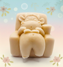 Load image into Gallery viewer, Handmade vegan cow sleeping on the sofa with book and coffee, shaped vegan soaps gift boxed. crafted with natural French clays, activated charcoal and essential oils. a eco-friendly, zero waste gift that’s cruelty-free, skin-nourishing, and perfect for animal lovers and gifting. small business UK