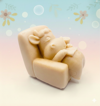 Load image into Gallery viewer, Handmade vegan cow sleeping on the sofa with book and coffee, shaped vegan soaps gift boxed. crafted with natural French clays, activated charcoal and essential oils. a eco-friendly, zero waste gift that’s cruelty-free, skin-nourishing, and perfect for animal lovers and gifting. small business UK