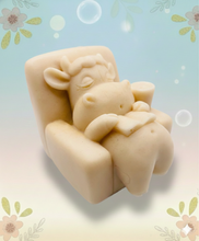 Load image into Gallery viewer, Handmade vegan cow sleeping on the sofa with book and coffee, shaped vegan soaps gift boxed. crafted with natural French clays, activated charcoal and essential oils. a eco-friendly, zero waste gift that’s cruelty-free, skin-nourishing, and perfect for animal lovers and gifting. small business UK