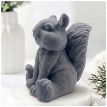 Load image into Gallery viewer, Handmade 3D squirrel-shaped soap sitting upright on a white marble display stand, featuring detailed textured fur and a bushy tail.
