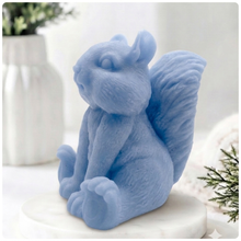 Load image into Gallery viewer, Handmade 3D squirrel-shaped soap sitting upright on a white marble display stand, featuring detailed textured fur and a bushy tail.