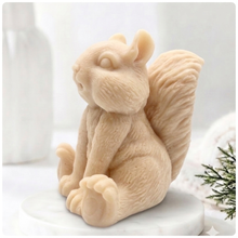 Load image into Gallery viewer, Handmade 3D squirrel-shaped soap sitting upright on a white marble display stand, featuring detailed textured fur and a bushy tail.