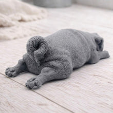 Load image into Gallery viewer, A detailed handmade vegan soap gift, sculpted in the shape of a pug dog lying flat on its stomach in a sleeping position, showing realistic skin folds and fur texture