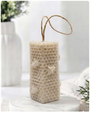 Load image into Gallery viewer, A tall, rectangular handmade vegan soap with a detailed honeycomb texture on all sides and small embossed bees, featuring a natural twine hanging rope, displayed upright on a light wooden surface.
