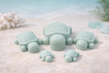 Load image into Gallery viewer, Handmade vegan soaps featuring a set of 5 turtle family soaps and gift boxed in beautiful eco friendly packaging
