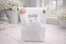 Load image into Gallery viewer, handmade vegan soap in the shape of a realistic standing alpaca or llama sculpture, featuring a smooth body with detailed fur texture on the head and neck, displayed in a bright farmhouse decor setting.