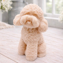 Load image into Gallery viewer, handmade vegan soap in the shape of a realistic sitting cockapoo or poodle sculpture, featuring detailed curly fur texture and a classic poodle groom, displayed on a rustic white wooden surface in a bright farmhouse decor setting.