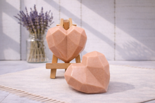 Load image into Gallery viewer, Two geometric heart-shaped vegan soaps on a stand with lavender in the background