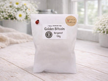 Load image into Gallery viewer, White soap bag with 'Golden Bitcoin' branding on a light wooden surface.