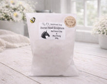 Load image into Gallery viewer, White soap bag with a label on a wooden surface, featuring a horse head sculpture design.