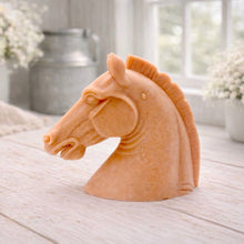Load image into Gallery viewer, horse head vegan soap gift sculpture on a light wooden surface with blurred floral and candle background