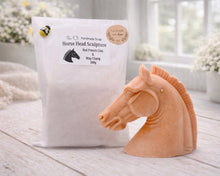 Load image into Gallery viewer, Horse head sculpture vegan soap next to its packaging on a farmhouse decor wooden surface