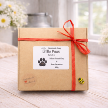 Load image into Gallery viewer, Handmade soap set packaging with a red ribbon on a wooden surface