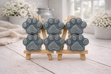 Load image into Gallery viewer, Gray paw-shaped vegan soap gift set on wooden stands with a light background