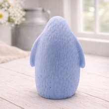 Load image into Gallery viewer, handmade vegan soap in the shape of a realistic young penguin sculpture, featuring a soft downy fur texture and a gentle expression, displayed in a bright farmhouse decor setting.