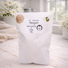 Load image into Gallery viewer, Handmade soap packaging with a penguin design on a light wooden surface.