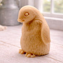Load image into Gallery viewer, handmade vegan soap in the shape of a realistic young penguin sculpture, featuring a soft downy fur texture and a gentle expression, displayed in a bright farmhouse decor setting.