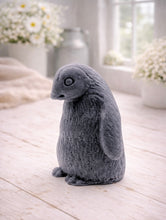 Load image into Gallery viewer, handmade vegan soap in the shape of a realistic young penguin sculpture, featuring a soft downy fur texture and a gentle expression, displayed in a bright farmhouse decor setting.