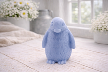 Load image into Gallery viewer, handmade vegan soap in the shape of a realistic young penguin sculpture, featuring a soft downy fur texture and a gentle expression, displayed in a bright farmhouse decor setting.