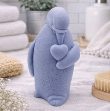 Load image into Gallery viewer, handmade vegan soap in the shape of a realistic penguin sculpture holding a small heart to its chest,