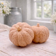 Load image into Gallery viewer, handmade vegan soaps in the shape of realistic chunky pumpkins, featuring detailed bumpy skin texture and stems, displayed on a rustic white wooden surface in a bright farmhouse decor setting.