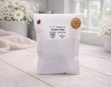 Load image into Gallery viewer, White bag labeled 'Flower Fairy' on a wooden surface with a blurred background