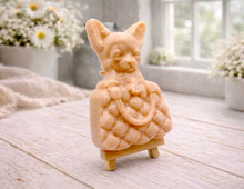 Load image into Gallery viewer, A highly detailed handmade vegan soap in a speckled grey marble finish, sculpted as a small chihuahua puppy with large ears peeking out from inside a quilted designer-style handbag, displayed on a miniature wooden easel.