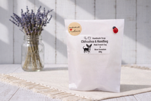 Load image into Gallery viewer, White packaging with branding and product details on a light wooden surface with lavender.