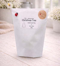 Load image into Gallery viewer, White soap packaging with a label on a light wooden surface