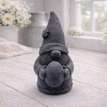 Load image into Gallery viewer, A detailed handmade vegan soap gift, sculpted as a whimsical Easter gnome (gonk) wearing a tall pointed hat with a flower detail, holding a large patterned Easter egg.
