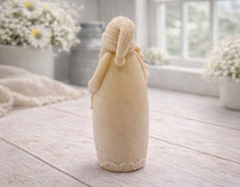 Load image into Gallery viewer, handmade vegan soap sculpted into a tall figure of Father Christmas wearing star-patterned robes, holding a small Christmas tree in one arm and a lantern in the other, set in a bright farmhouse window.