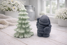 Load image into Gallery viewer, A duo of handmade vegan soaps featuring a Father Christmas figure with standing next to a mint-green tiered 3D Christmas tree, displayed in a bright farmhouse setting.