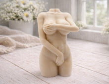 Load image into Gallery viewer, A 3D handmade vegan soap sculpted into a detailed female torso with soft, realistic curves and defined musculature and displayed in a bright farmhouse setting.