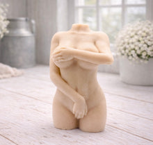 Load image into Gallery viewer, A 3D handmade vegan soap sculpted into a detailed female torso with soft, realistic curves and defined musculature and displayed in a bright farmhouse setting.