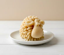 Load image into Gallery viewer, A highly detailed handmade vegan soap sculpted in the shape of a fluffy sheep with thick, textured wool and a smooth face, displayed on a light wooden surface in a farmhouse-style setting.