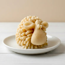 Load image into Gallery viewer, A highly detailed handmade vegan soap sculpted in the shape of a fluffy sheep with thick, textured wool and a smooth face, displayed on a light wooden surface in a farmhouse-style setting.