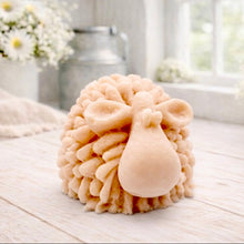 Load image into Gallery viewer, A highly detailed handmade vegan soap sculpted in the shape of a fluffy sheep with thick, textured wool and a smooth face, displayed on a light wooden surface in a farmhouse-style setting.