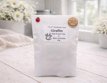 Load image into Gallery viewer, White soap packaging with a label on a wooden surface