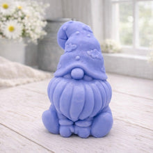 Load image into Gallery viewer, A handmade vegan soap in a natural tone, sculpted as a gnome (gonk) with a tall, curved hat that covers the eyes and has clouds on it, a round nose, and a long, textured beard.