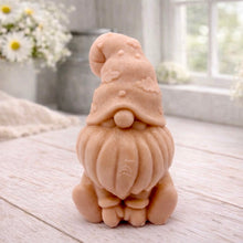 Load image into Gallery viewer, A handmade vegan soap in a natural tone, sculpted as a gnome (gonk) with a tall, curved hat that covers the eyes and has clouds on it, a round nose, and a long, textured beard.