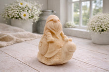 Load image into Gallery viewer, A handmade vegan soap gift, sculpted as a whimsical gnome (gonk) with a tall, slouchy hat and a long beard, sitting on the shell of a large snail with a textured, bumpy body.