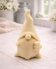 Load image into Gallery viewer, A cream-coloured handmade vegan soap sculpted as a tall, whimsical gnome (gonk) with a pointed hat and long beard, featuring a natural twine hanging rope at the top and displayed in a bright farmhouse setting.