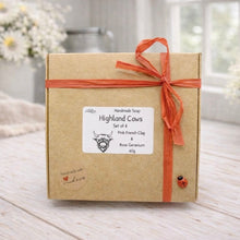 Load image into Gallery viewer, Box of Highland Cows handmade soap with a decorative ribbon on a wooden surface.