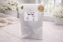 Load image into Gallery viewer, White bag of 'Koi Fish' soap with a label on a wooden surface