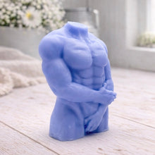 Load image into Gallery viewer, A 3D handmade vegan soap sculpted into a detailed male torso with defined chest and abdominal muscles, finished in a soft tone and displayed in a bright farmhouse setting.