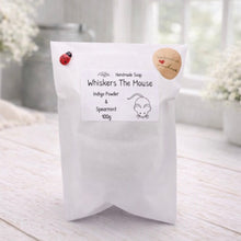 Load image into Gallery viewer, White soap packaging with 'Whiskers The Mouse' branding on a light wooden surface.